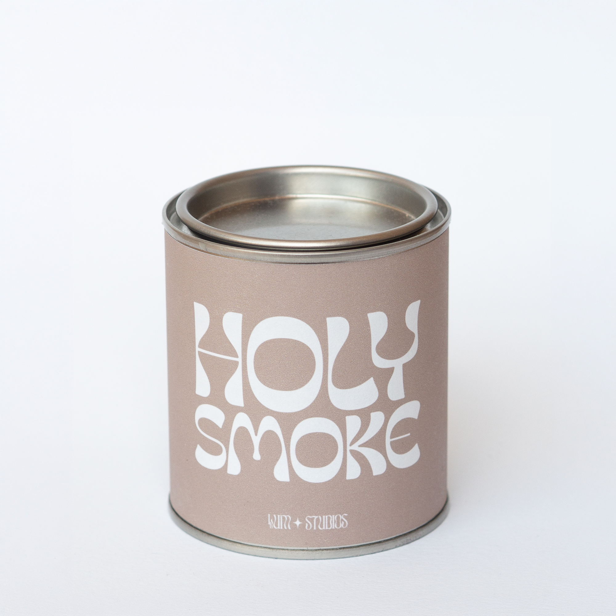 Llum Studios Holy Smoke vegan scented candle in a reusable tin with taupe sugarcane paper wraparound label, sustainably packaged and ethically made, on a white background