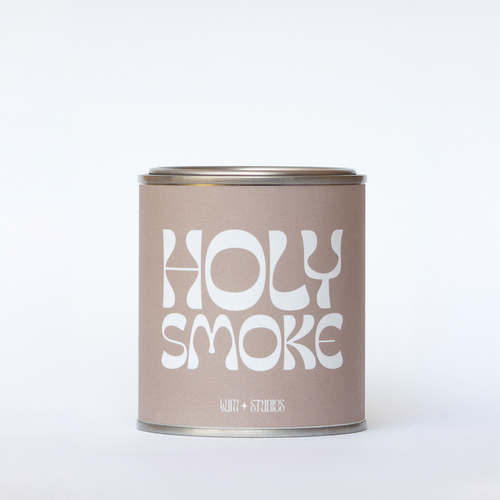 Llum Studios Holy Smoke vegan scented candle in a reusable tin with taupe sugarcane paper wraparound label, sustainably packaged and ethically made, on a white background
