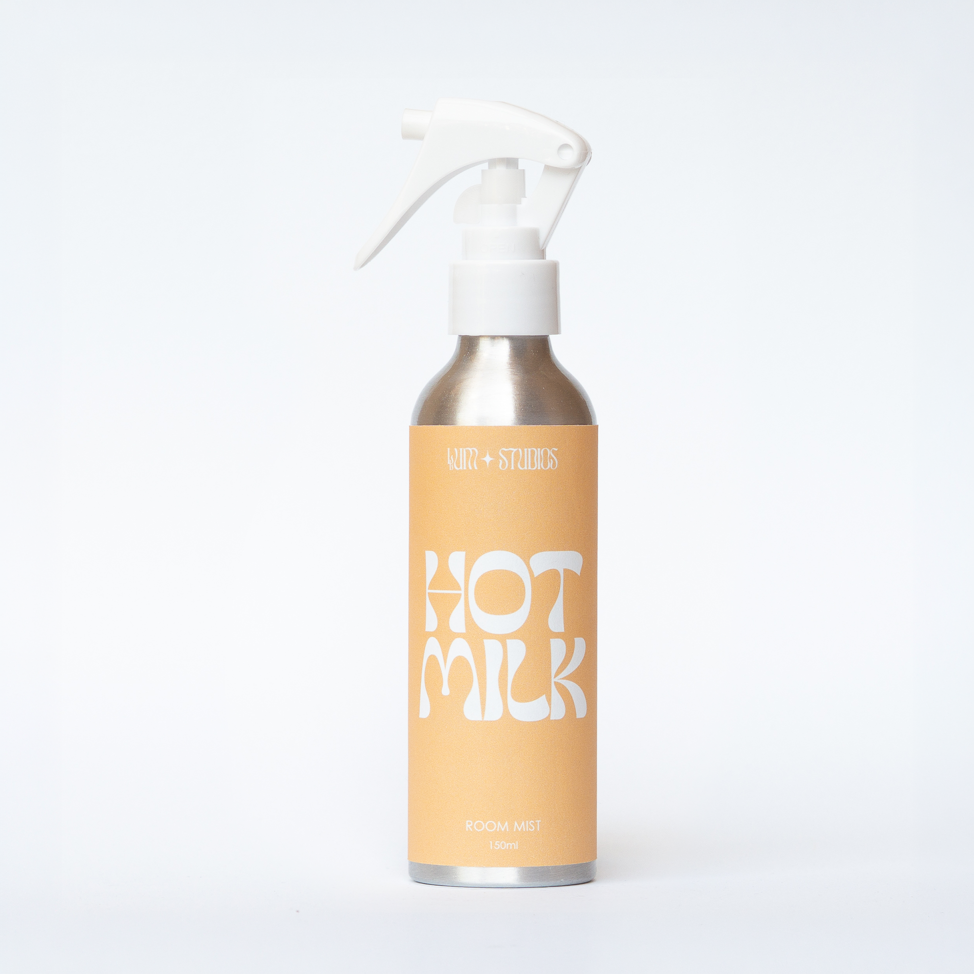 Llum Studios Hot Milk natural 150ml room mist in a sustainable aluminium spray bottle, warm yellow, ethically made, on a white background