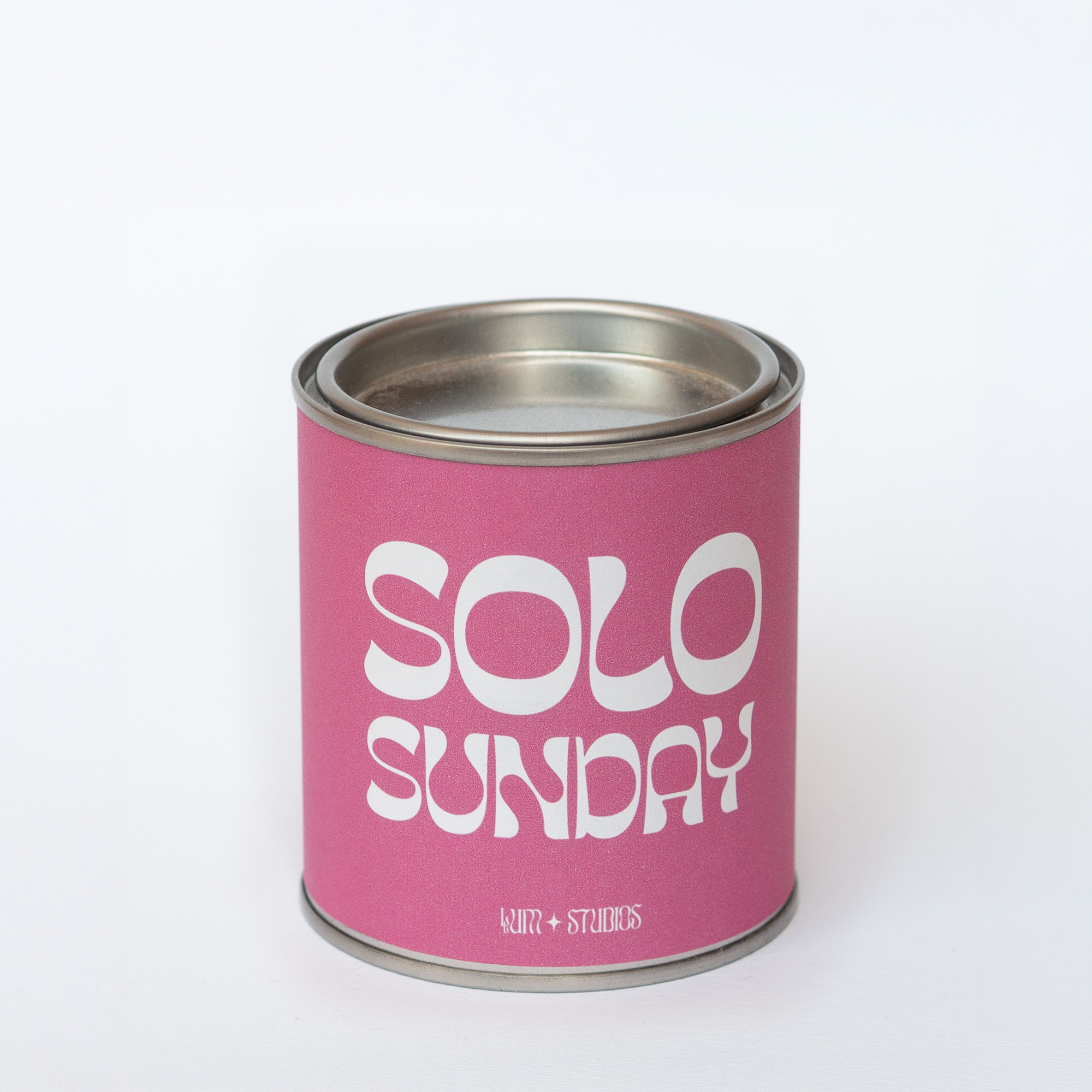 Llum Studios Solo Sunday vegan scented candle in a reusable tin with hot pink sugarcane paper wraparound label, sustainably packaged and ethically made, on a white background