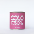 Llum Studios Solo Sunday vegan scented candle in a reusable tin with hot pink sugarcane paper wraparound label, sustainably packaged and ethically made, on a white background